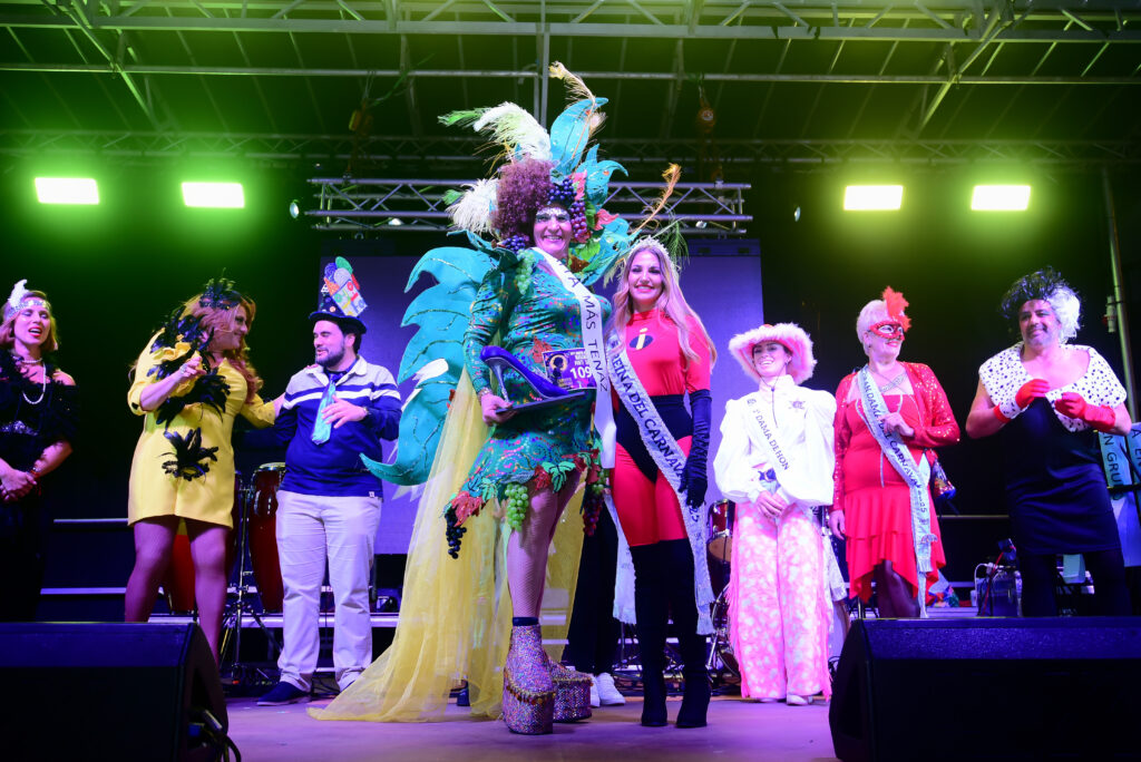 Costumed Mascarita Ponte Tacón participants celebrating on stage in Puerto de la Cruz