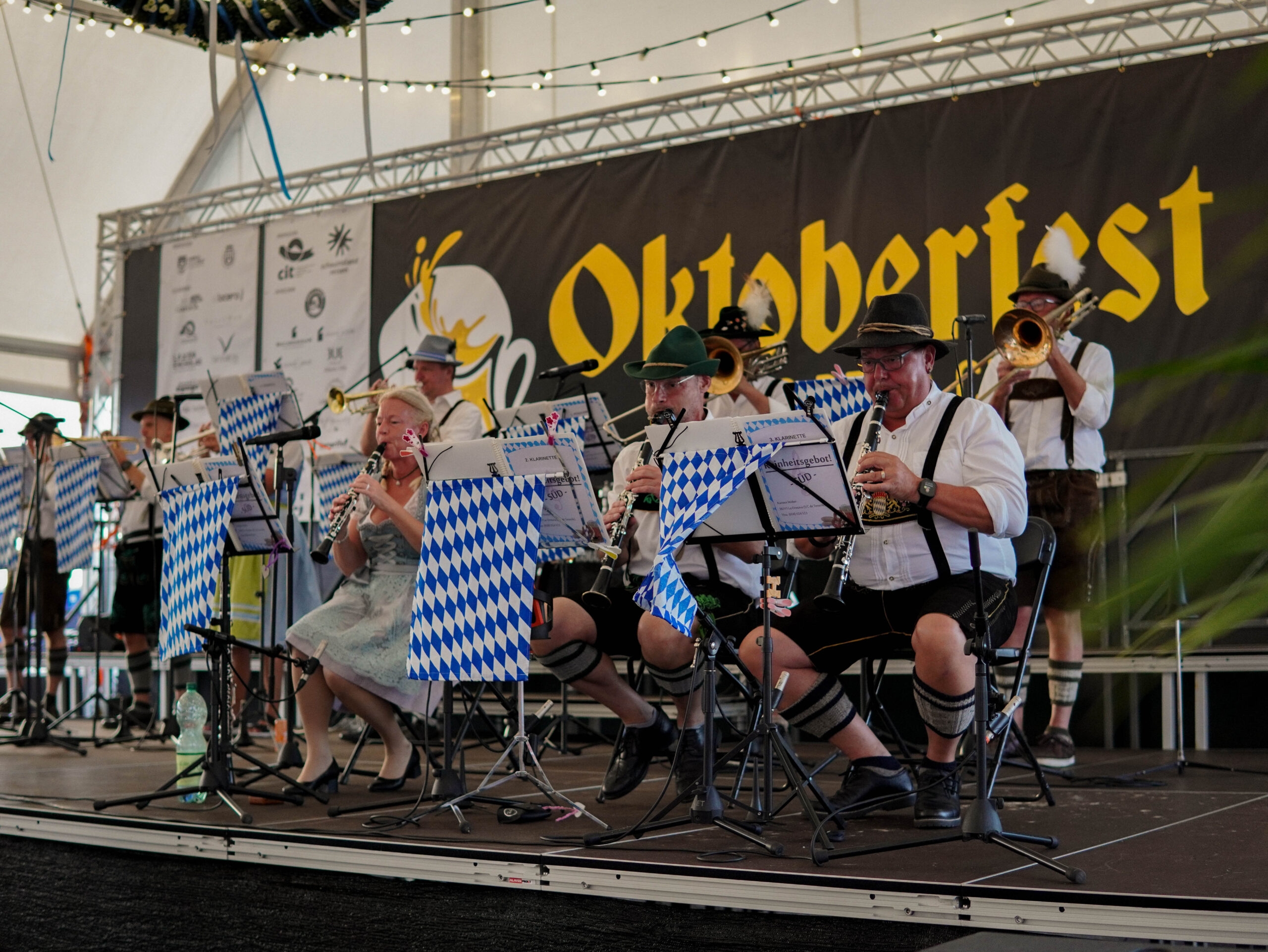 Bavarian brass musicians performing on the Oktoberfest stage in Puerto de la Cruz