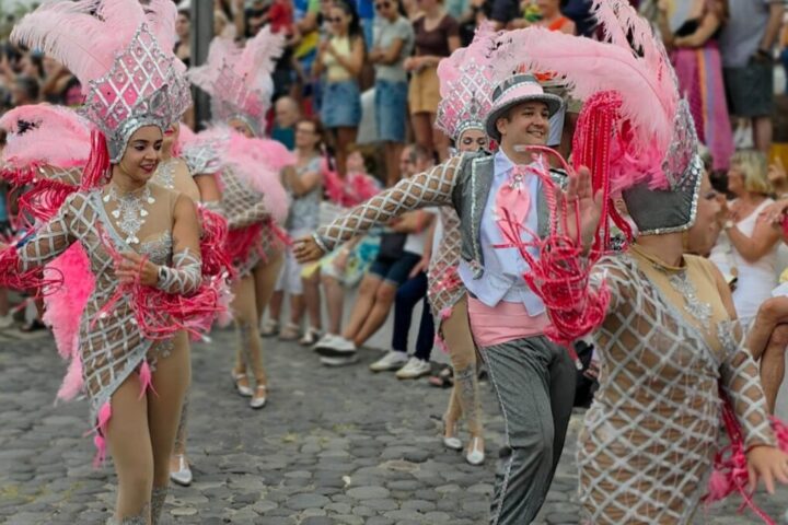 Carnival performers in colourful costumes at Puerto de la Cruz Summer Carnival
