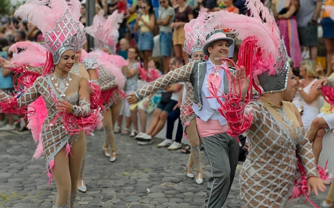 Carnival performers in colourful costumes at Puerto de la Cruz Summer Carnival