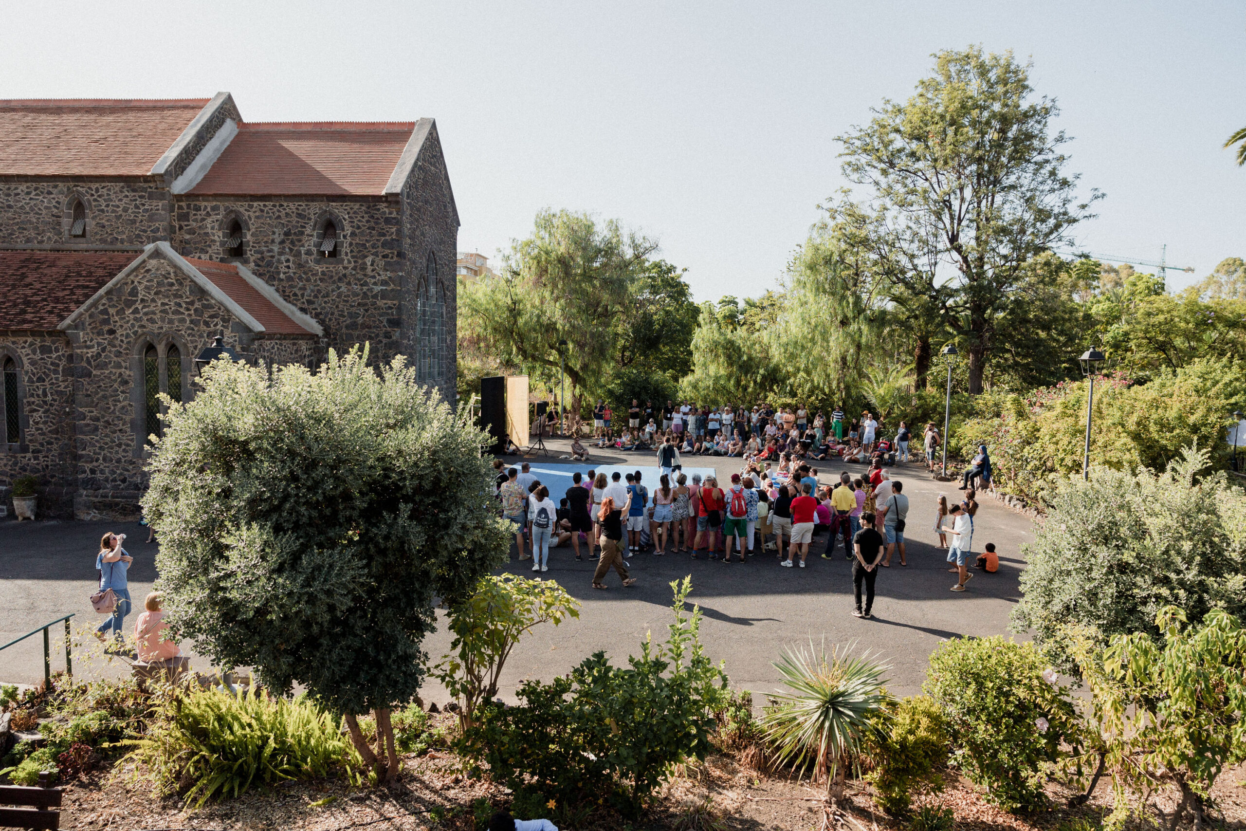 Festival visitors moving through Parque de la Sortija in Puerto de la Cruz